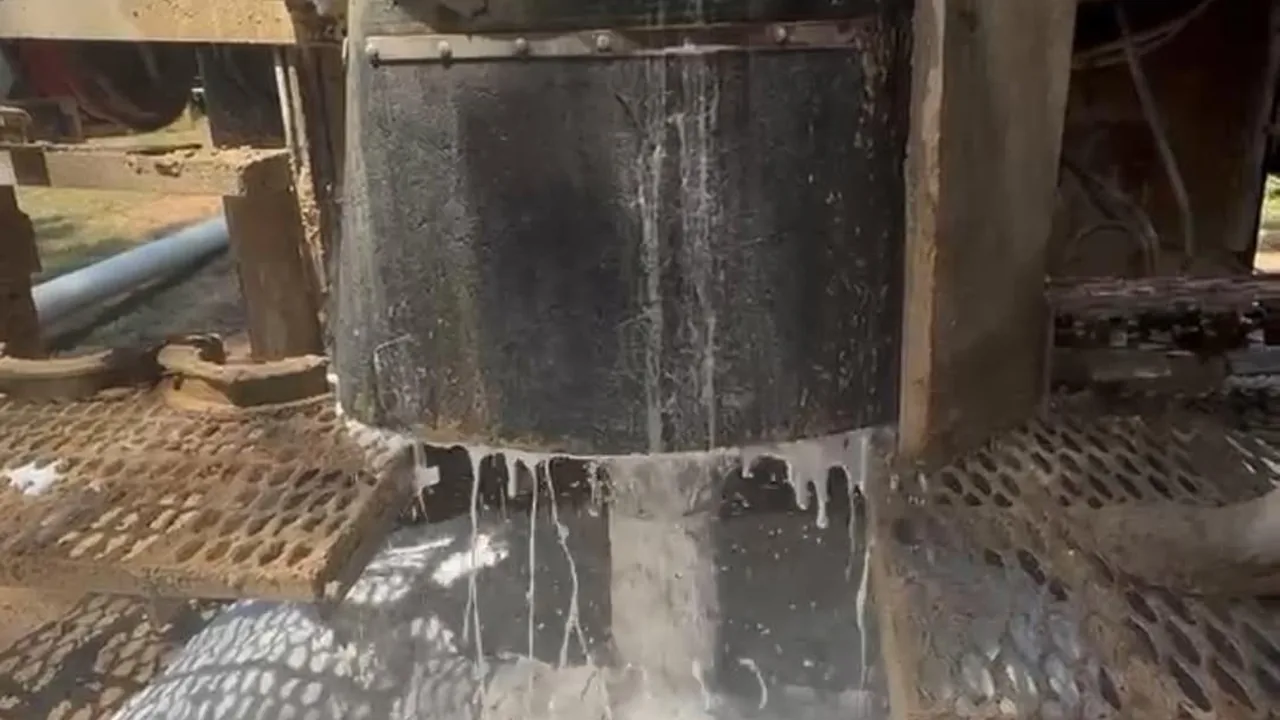 Water washing across the rig deck around the drill stem as a new well is developed